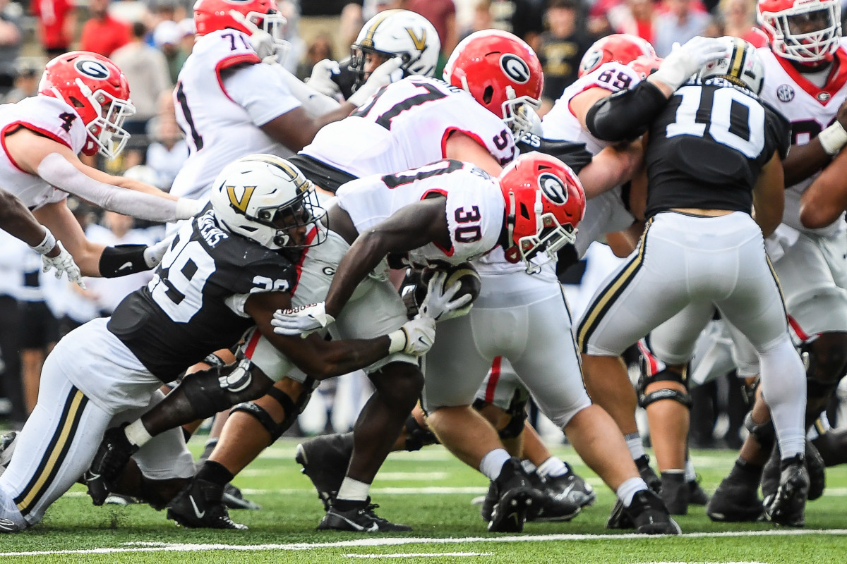 Oct 14, 2023; Nashville, Tennessee, USA; Georgia Bulldogs running back Daijun Edwards (30) dives into the end zone against the Vanderbilt Commodores during the second half at FirstBank Stadium. Mandatory Credit: Steve Roberts-USA TODAY Sports